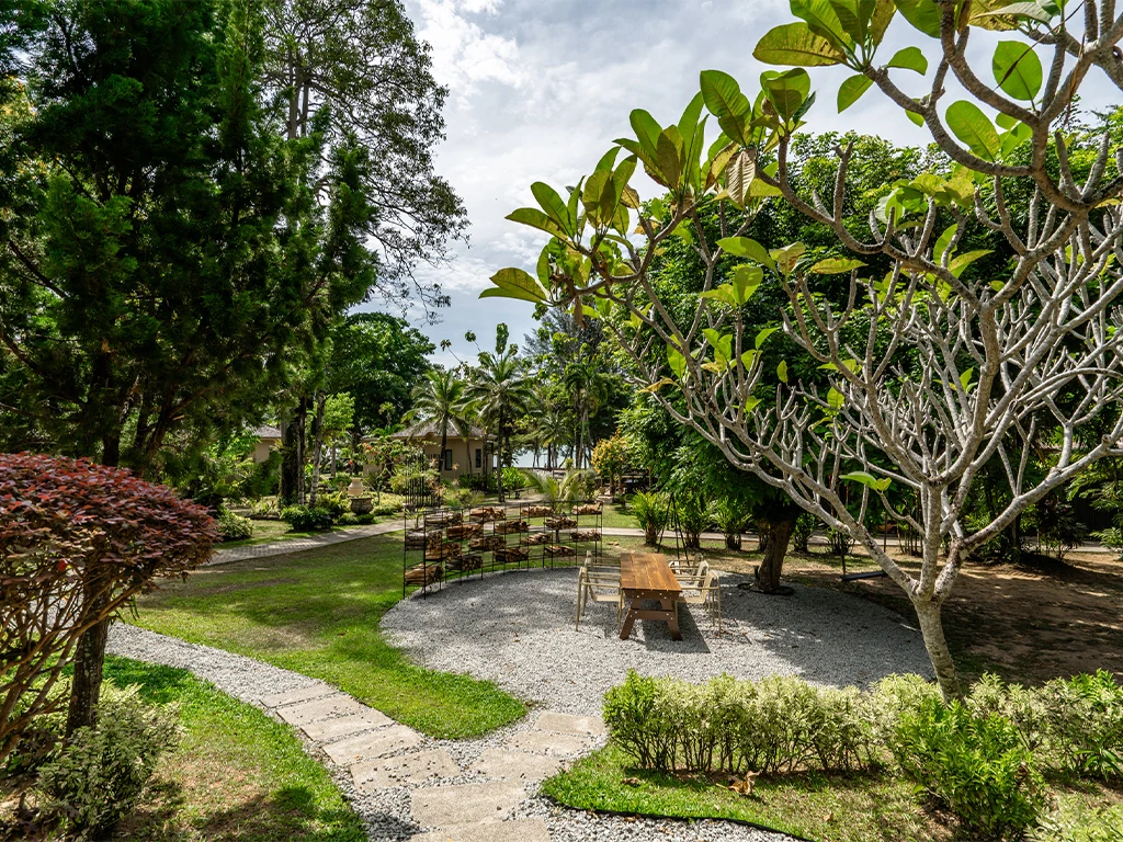 Garden seating outside the connecting family room area at The Mangrove by Blu Monkey