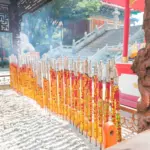 Rows of ceremonial incense sticks at a Chinese temple
