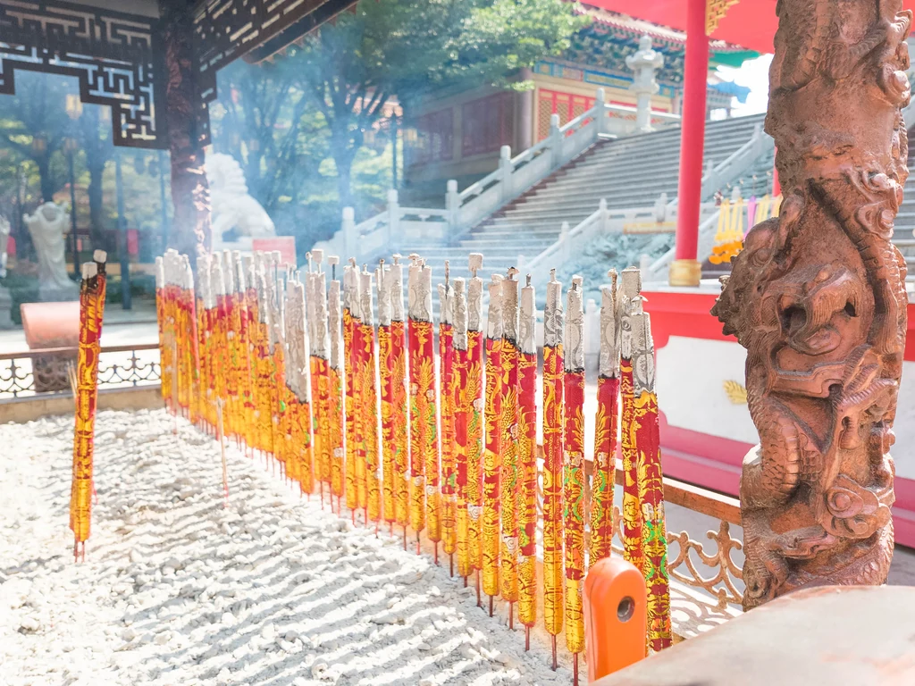 Rows of ceremonial incense sticks at a Chinese temple